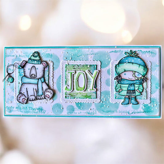 Winter 'JOY' slimline card made with AALL & Create Letter Soup dies featuring fussy cut polar bear in scarf and bundled-up child character, turquoise and white watercolour background with embossed snowflakes and script text