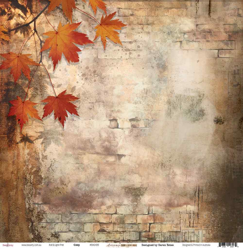 Front side of Bee Arty Cozy 12x12 paper featuring an atmospheric aged brick wall with autumn maple branches trailing in from the upper left in rich reds and burnt oranges, from the Autumn Whispers collection by Karen Yates
