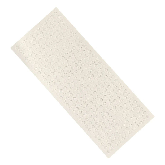 Sheet of mini foam adhesive dots on a white background.
