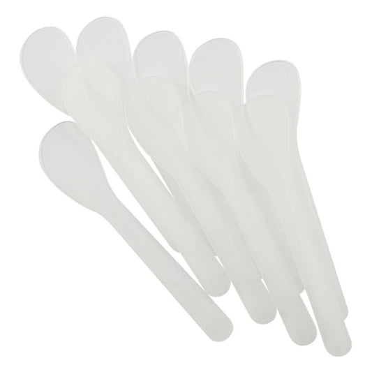 Set of white plastic glue spreaders on a white background