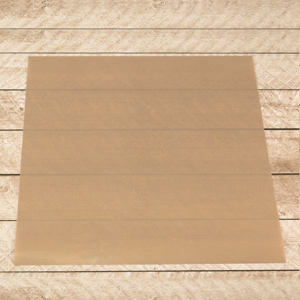 Brown non-stick craft mat shown flat on a wooden background.