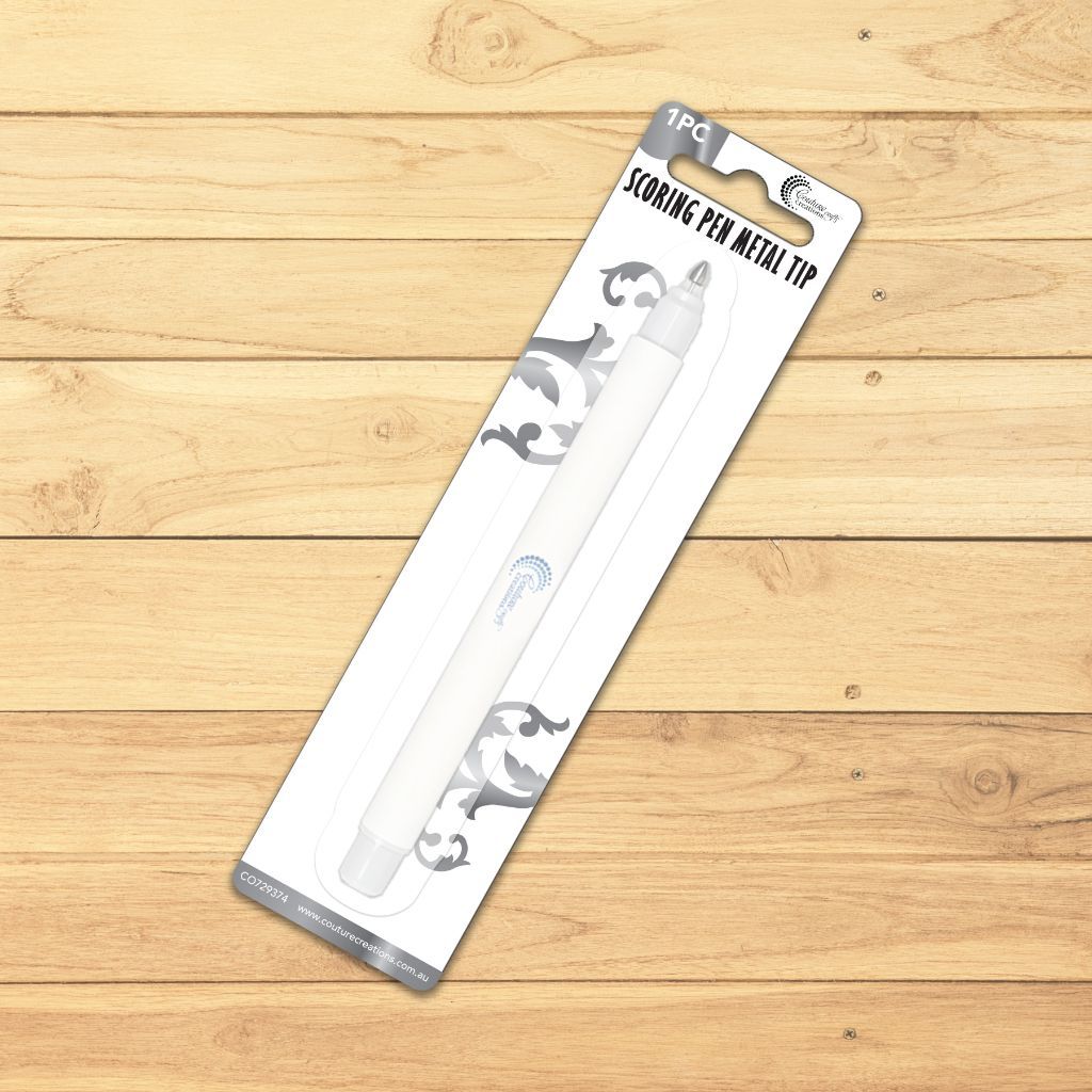 Packaged scoring pen metal tip on a wooden surface