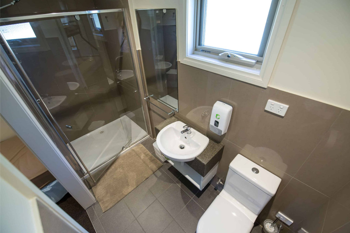 Modern ensuite bathroom with shower in retreat accommodation at Lyrebird Park Conference Centre, Yellingbo