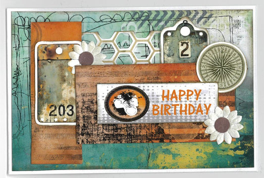 Oh Texture Happy Birthday card with teal and orange textured papers, camera, compass, number tags and white paper flowers
