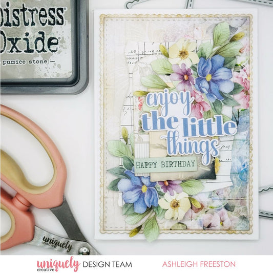 Handmade birthday card by Ashleigh Freeston using Uniquely Creative Floral Archives collection – features layered florals in blue, purple, and pink tones, scalloped border, and sentiments “enjoy the little things” and “Happy Birthday.” Vintage-style background with musical notes adds charm to this elegant design.