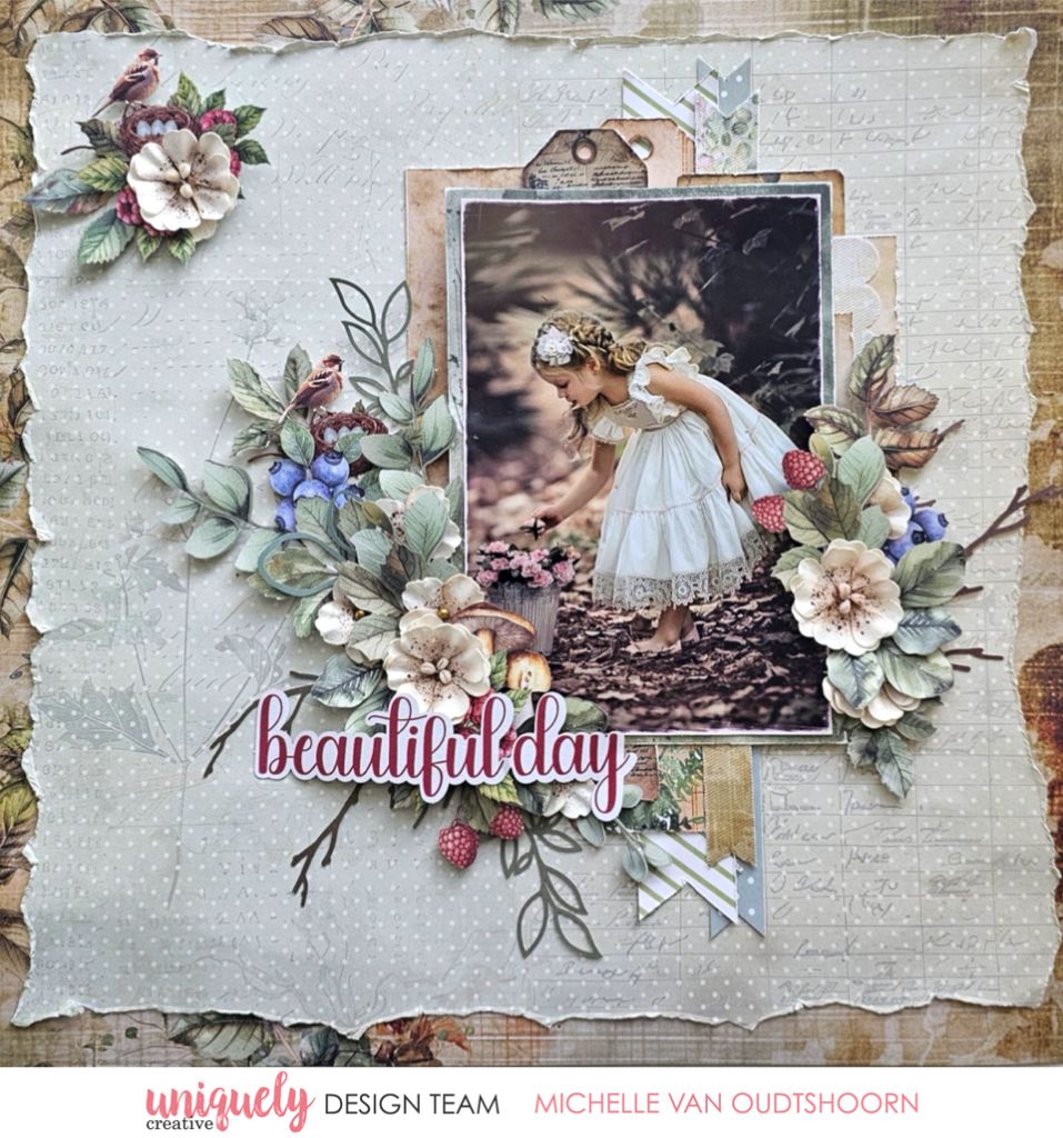 Scrapbook page by Michelle Van Oudtshoorn using Uniquely Creative Botanical Chronicles collection – features a nature photo of a girl in a white dress picking flowers, framed by lush embellishments like birds, berries, and layered florals. Neutral textured background and “beautiful day” sentiment evoke a peaceful, woodland-inspired memory.