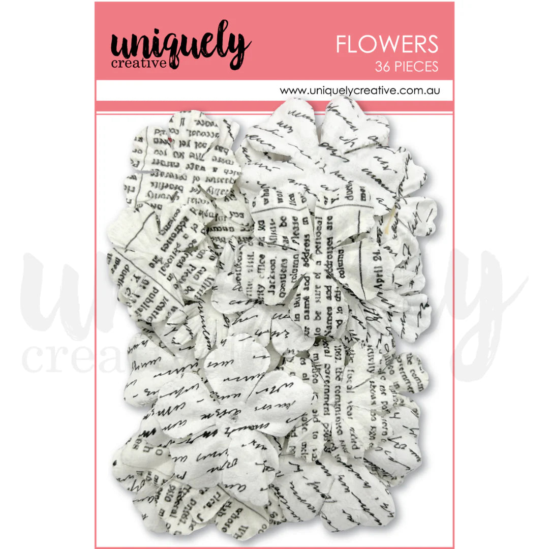 Uniquely Creative Antique Petal Press Flowers showing 36 white paper flowers printed with vintage black script and text patterns in various sizes