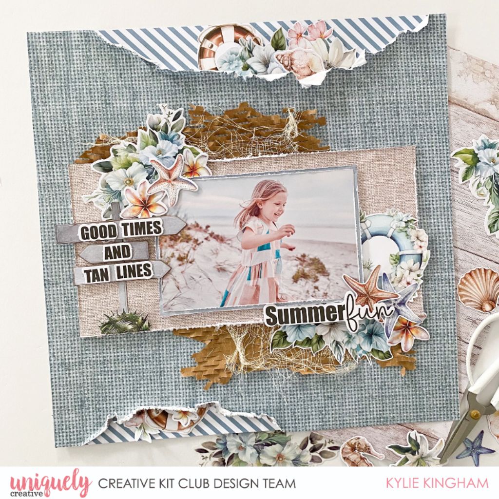 Scrapbook layout using Uniquely Creative Beach Sign Die with beach photo, good times and tan lines sentiment, summer fun text, shells, starfish and coastal flowers on blue textured background