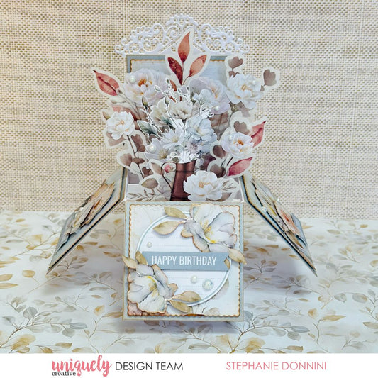 Handmade box card by Stephanie Donnini using Uniquely Creative Bohemian Escape collection – features layered floral die cuts, pearl accents, and a “Happy Birthday” sentiment. Created with the coordinating box card die for a dimensional, elegant birthday greeting.