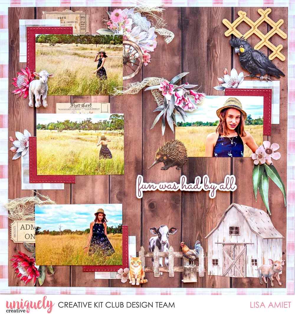 Country-themed scrapbook layout with four outdoor photos, natural muslin accents, flowers and farm animal embellishments on a woodgrain background