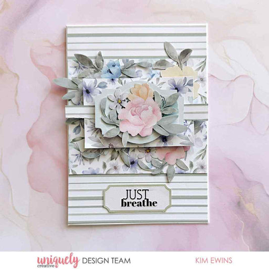 Handmade card sample made with Heart & Soul papers, featuring floral layers, striped paper, a large pink flower and a “Just Breathe” label.