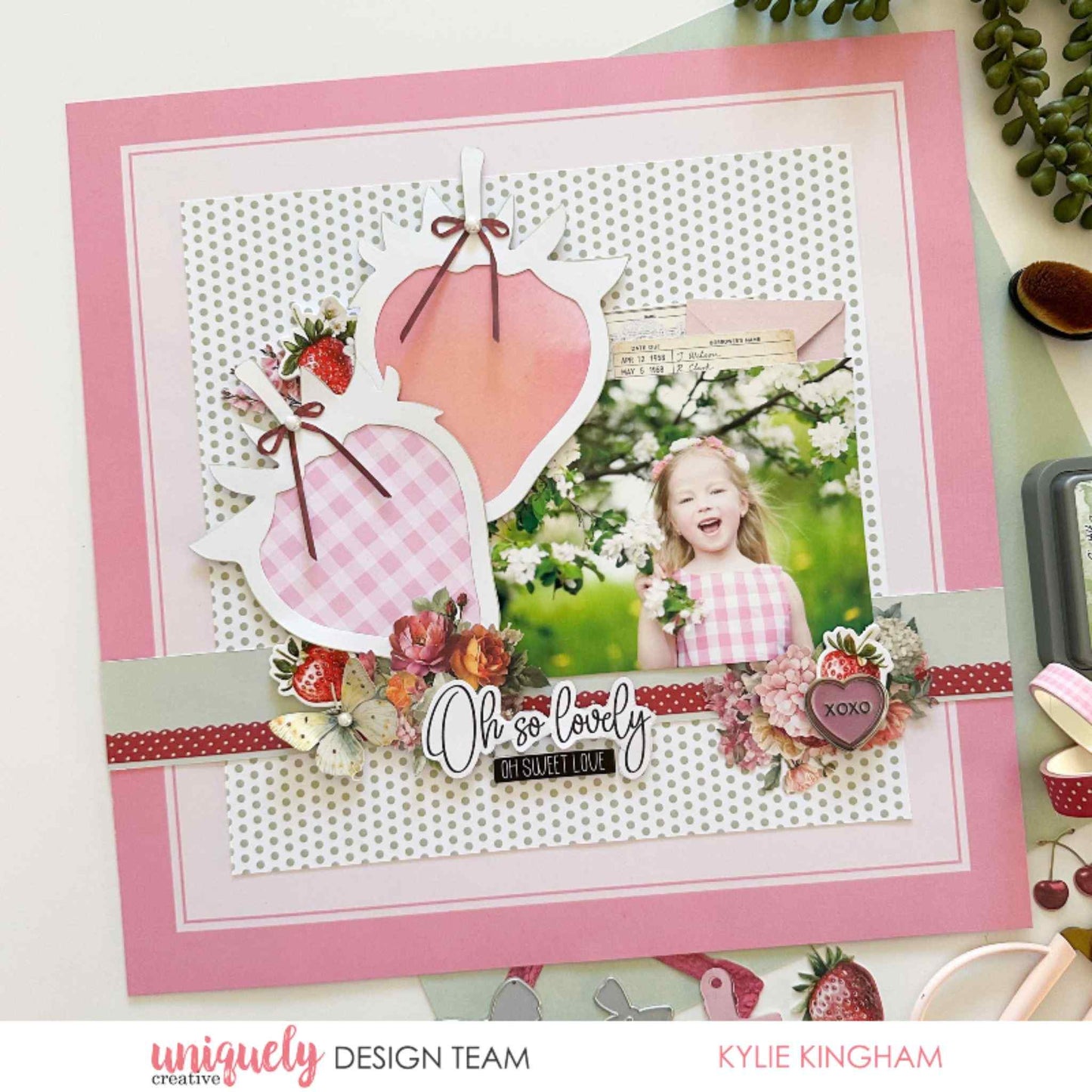 Scrapbook layout using Uniquely Creative Oh So Lovely collection featuring a strawberry shaped overlay, gingham and polka dot papers, floral cluster and Oh So Lovely sentiment with a child's photo by Kylie Kingham