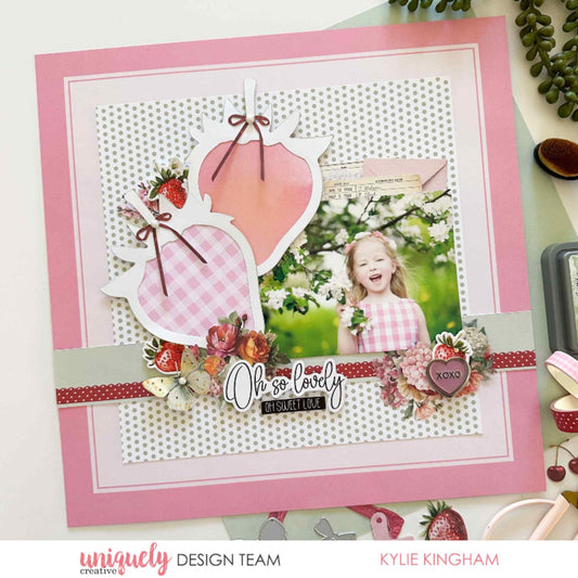 Scrapbook layout using Uniquely Creative Oh So Lovely collection featuring a strawberry shaped overlay, gingham and polka dot papers, floral cluster and Oh So Lovely sentiment with a child's photo by Kylie Kingham