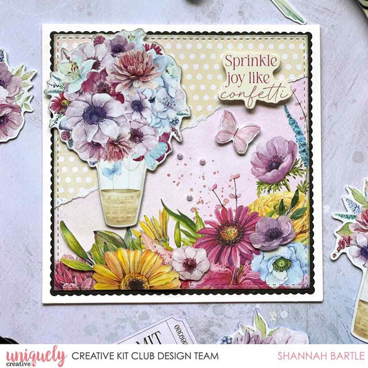 Square card with a scalloped square layered under a stitched square die cut, layered florals, a hot air balloon and a Sprinkle joy like confetti sentiment