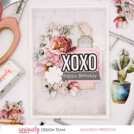 Tea and Tranquility handmade card by Uniquely Creative design team — "XOXO Happy Birthday" card featuring lush watercolour peony and magnolia clusters, luggage tag and ticket die-cuts, and bold XOXO sentiment in soft blush, dusty pink, and sage