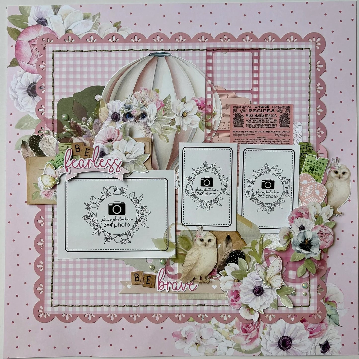 Whispers of Wisdom scrapbook layout featuring pink gingham background, die-cut scalloped borders, watercolour hot air balloon and anemone florals, three photo mats with floral wreaths, vintage ephemera, owl embellishments, and Be Fearless Be Brave sentiments
