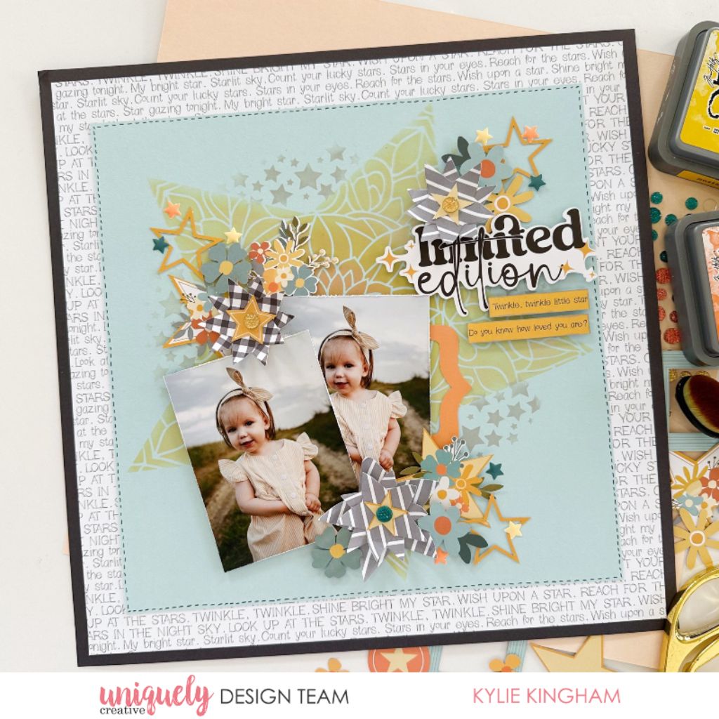 Limited edition scrapbook layout featuring twin photos with Uniquely Creative Written in the Stars collection papers, die-cut stars, floral embellishments and white text background paper