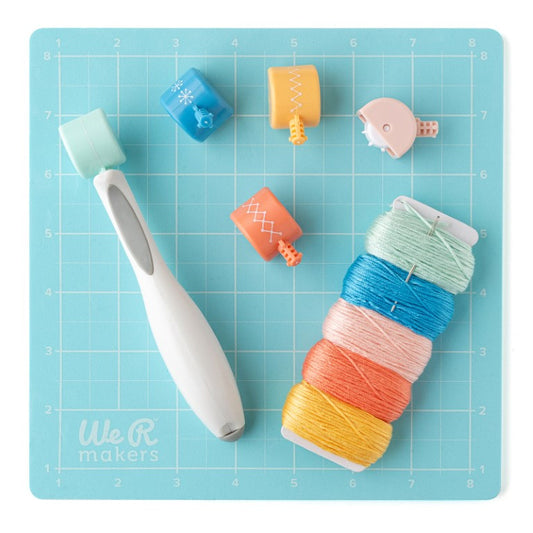 We R Makers Sew Easy Kit contents showing piercing tool, interchangeable roller heads in blue, pink, orange and yellow with thread skeins