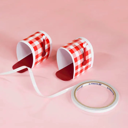 Two small letterboxes made from cardstock with a roll of X-Press It double sided tape used to make them.