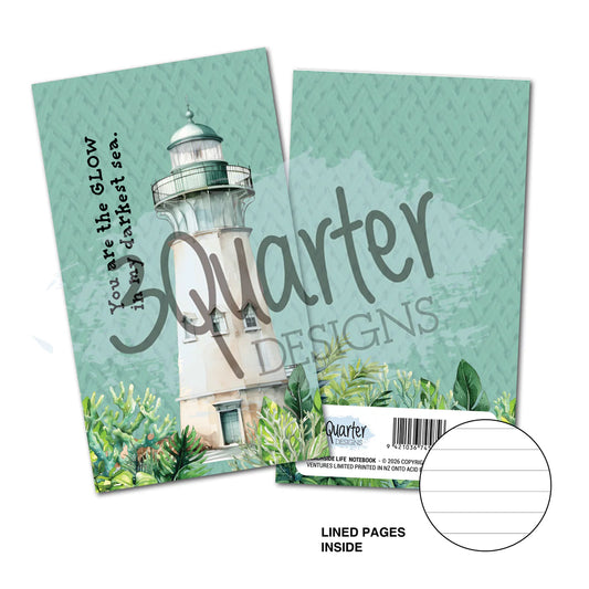 Beachside Life Mini Notebook by 3Quarter Designs featuring watercolour lighthouse with coastal greenery on aqua background, showing lined pages inside