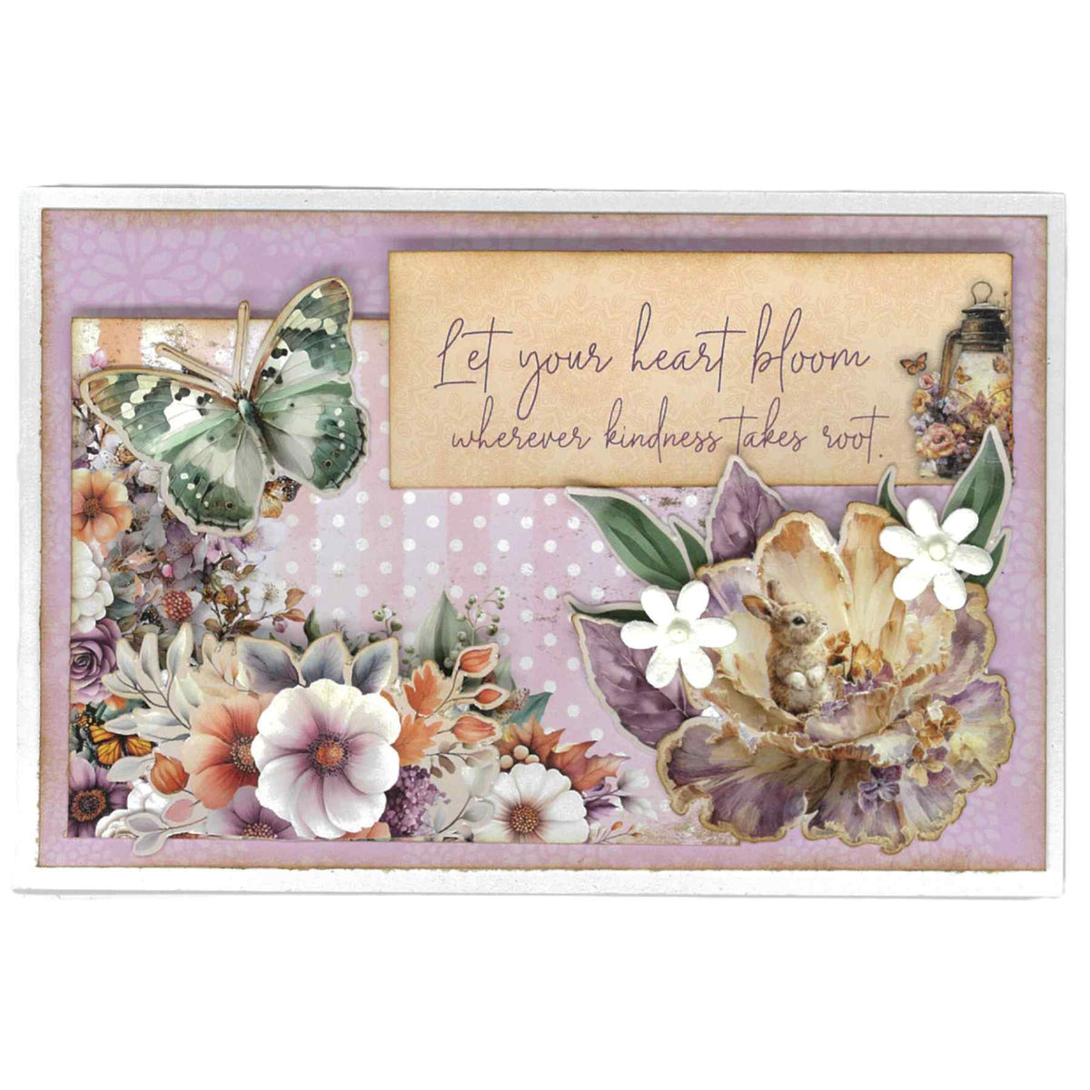 Landscape card with a green butterfly and flowers on the left, a rabbit among layered flowers on the right, and “Let your heart bloom wherever kindness takes root” across the top