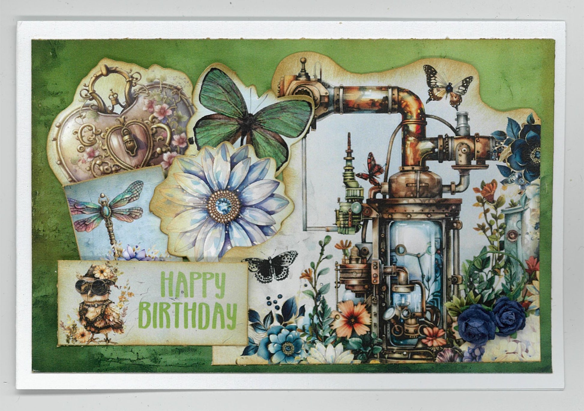 Floral Mechanica 6x4 Card Making Kit by 3Quarter Designs — Happy Birthday card with steampunk distiller, green butterfly, dragonfly, blue daisy, heart locket, and steampunk bird on green background 