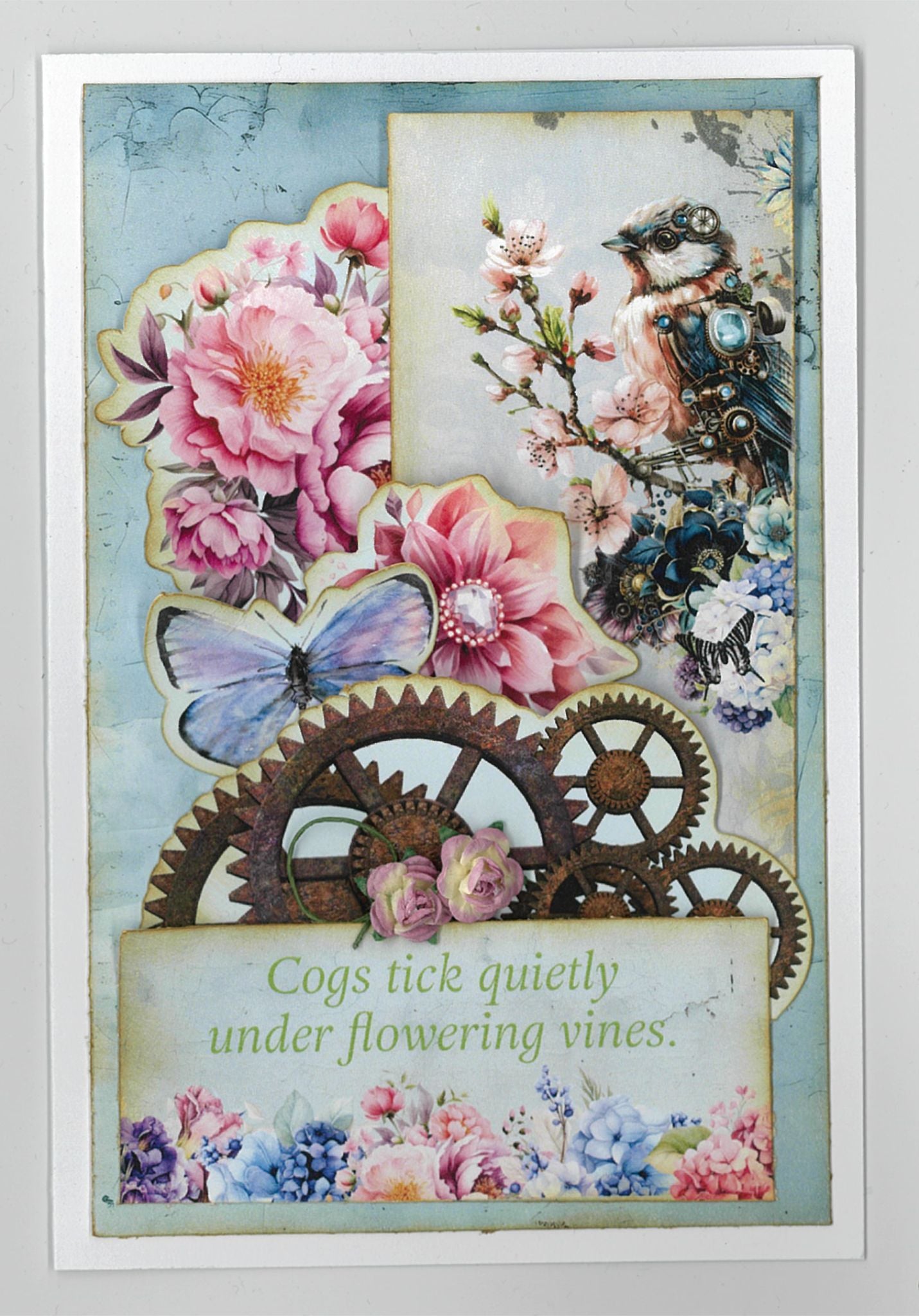 Floral Mechanica 6x4 Card Making Kit by 3Quarter Designs — portrait card with steampunk mechanical bird, rusty gears, blue butterfly, pink peonies, and "Cogs tick quietly under flowering vines" sentiment