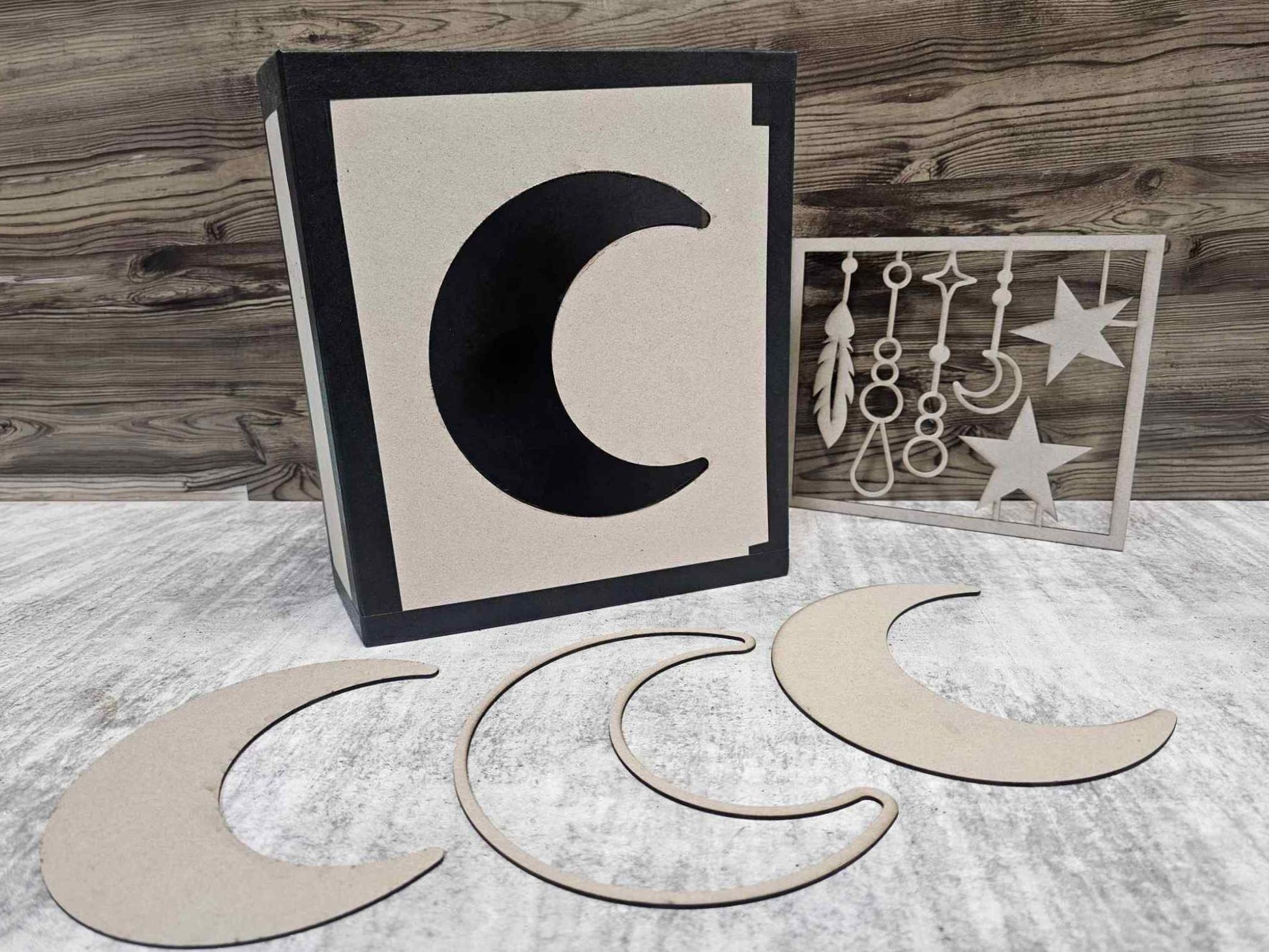 3QD Moon Album chipboard cover with crescent moon cut-out alongside two loose chipboard moon shapes and dangles design