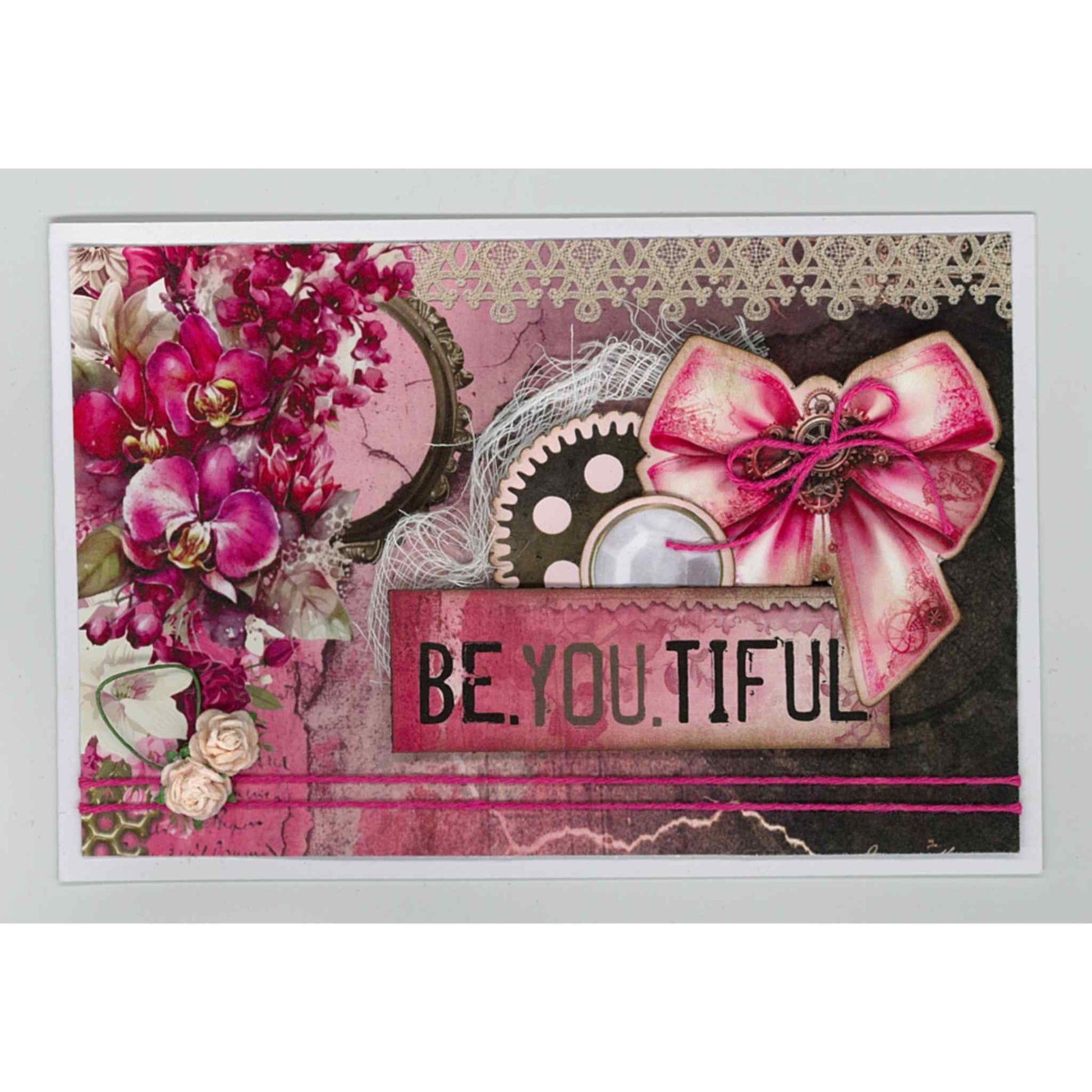 Handmade landscape card using Mrs Aeronaut kit with cerise orchids, steampunk gear, lace and cerise bow, with Be.You.Tiful sentiment on pink and dark mixed background with lace border
