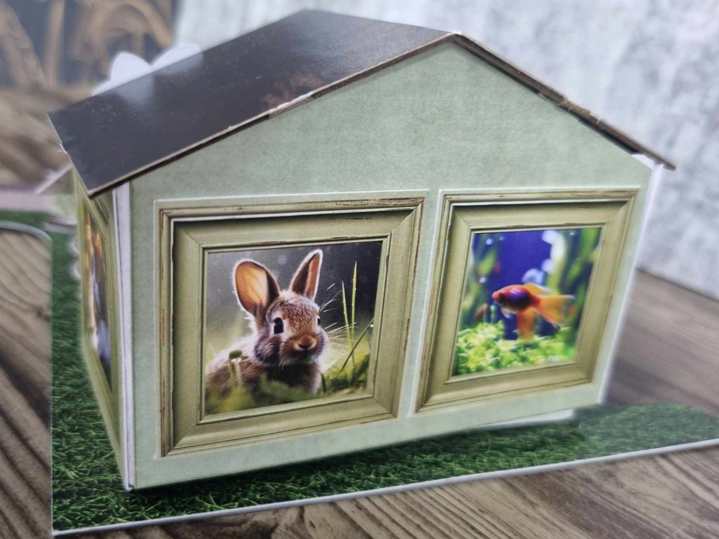 3Quarter Designs Pet Tails Pet Shop rear view showing the photo frame windows with rabbit and goldfish illustrations and the dark timber grain roof