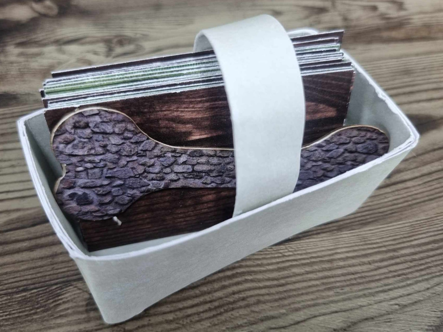 3Quarter Designs Pet Tails Pet Shop paper basket filled with mini album cards and the bone-shaped piece tucked inside