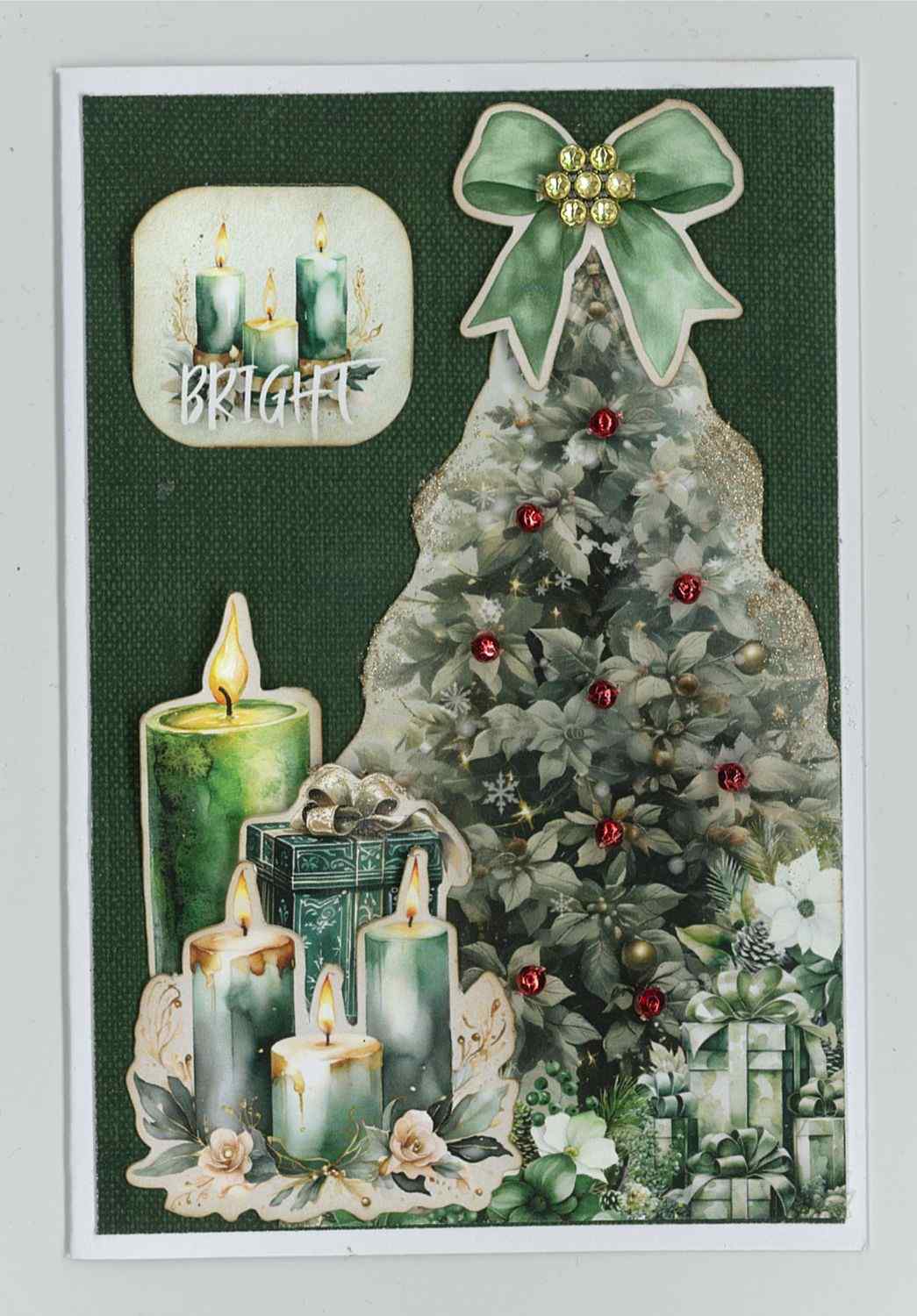 Pine Festivities card sample showing a portrait card with dark green background, die-cut Christmas tree with red gem embellishments, green candles, gift box and Bright word tile