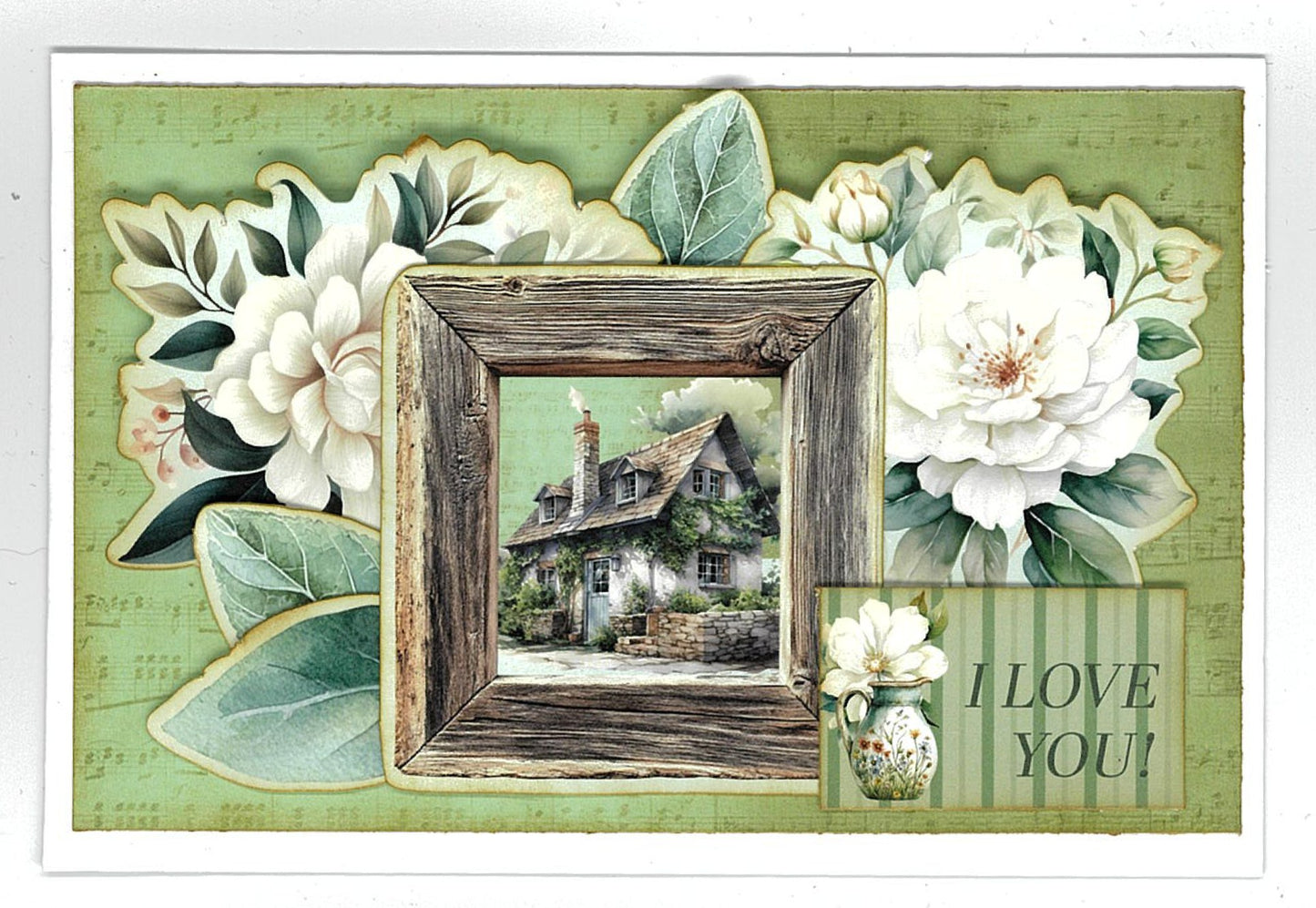 Handmade card using 3Quarter Designs Sage Candlelight 6x4 Card Making Kit with die-cut white magnolia blooms, a rustic timber frame enclosing a cottage scene, and an "I Love You" sentiment tag on sage green music sheet paper