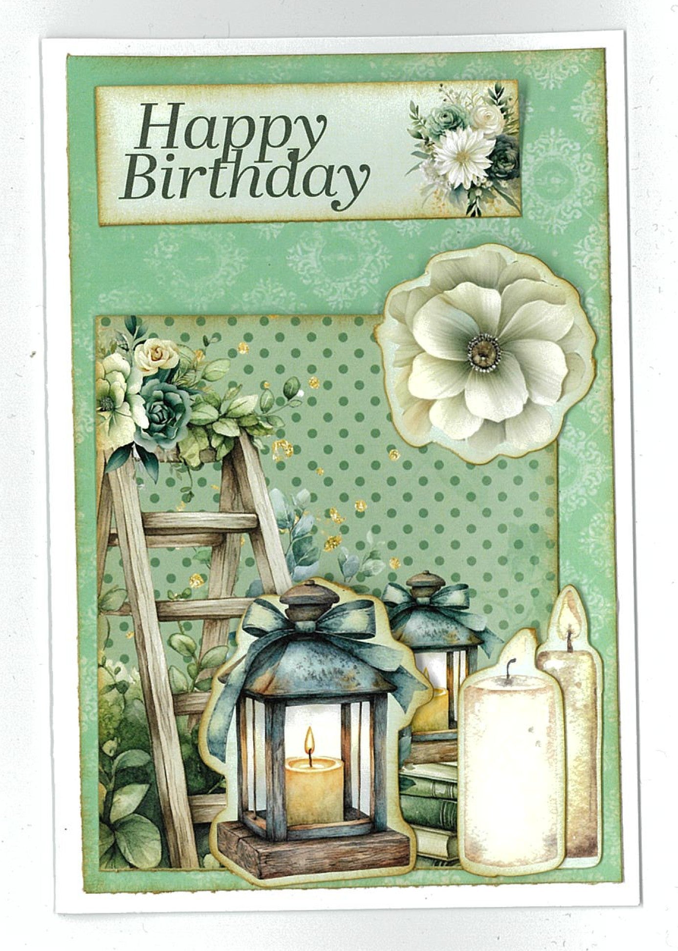Handmade birthday card using 3Quarter Designs Sage Candlelight 6x4 Card Making Kit with die-cut wooden ladder, candle lanterns with teal bows, stacked books, a white anemone bloom, and a "Happy Birthday" sentiment on sage green polka dot paper