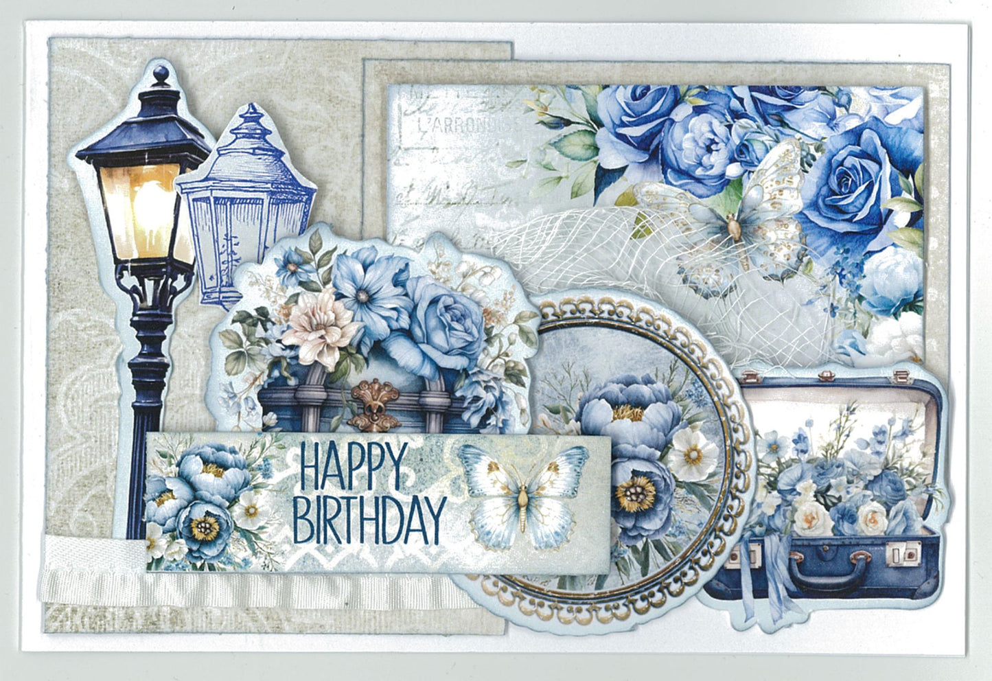 Twilight Ink 6x4 Card Making Kit by 3Quarter Designs — landscape Happy Birthday card with street lantern die-cut, vintage suitcase, pearl-framed cameo, butterfly, blue roses, peonies, and vintage postcard paper on cream background