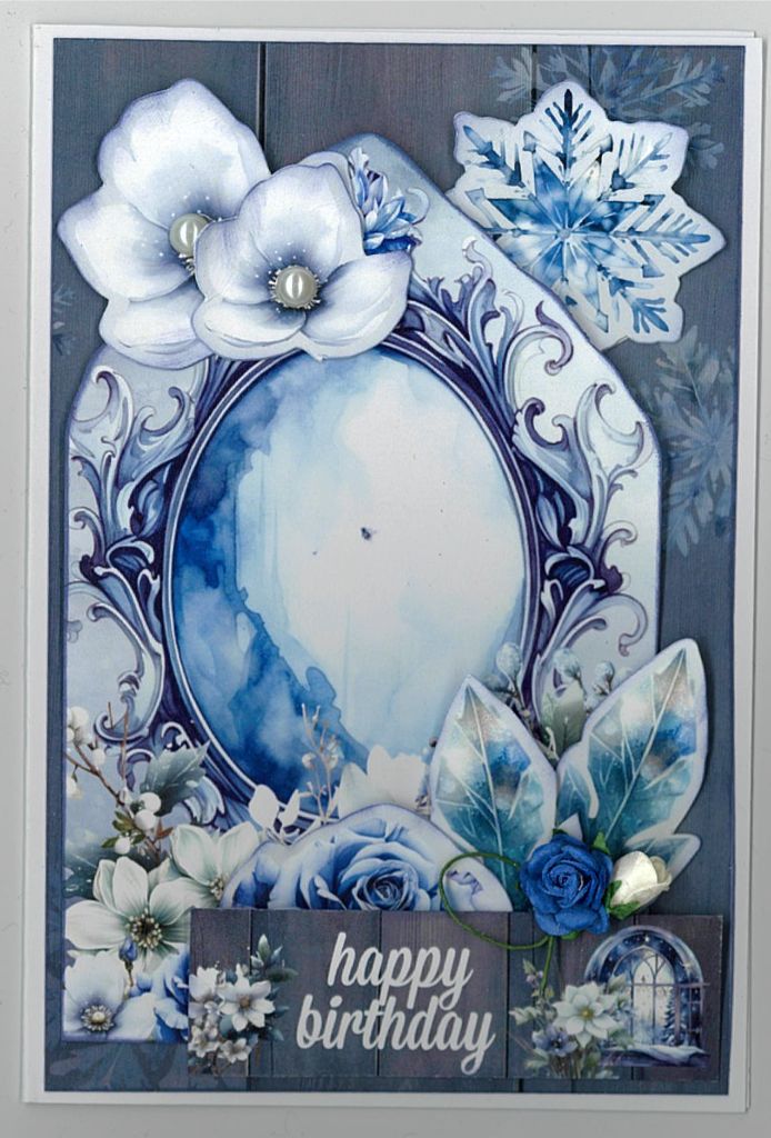 Handmade winter birthday card with blue florals, snowflakes, and “happy birthday” sentiment
