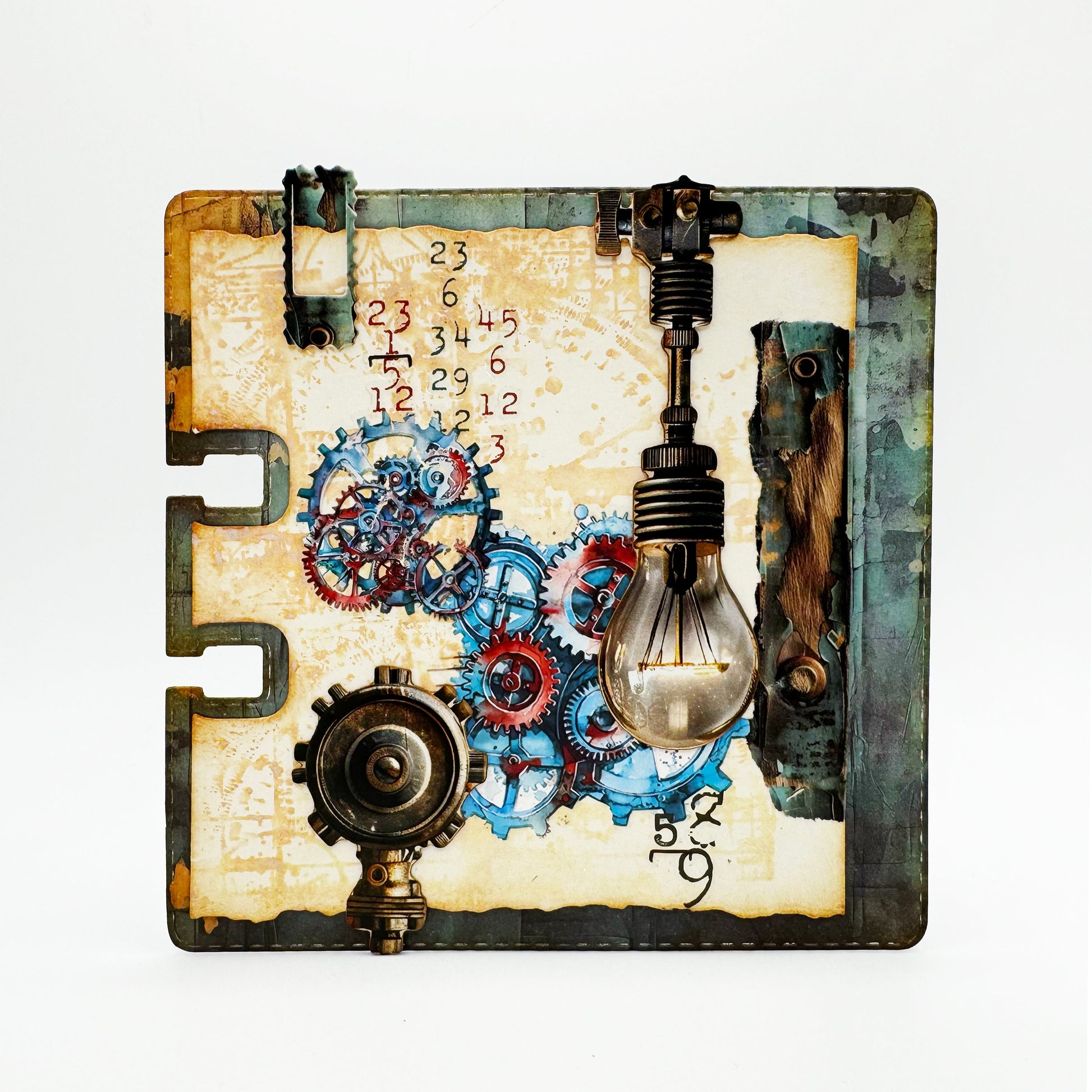 Mixed media index card made with AALL & Create Cogs & Curios rub-ons featuring turquoise and coral mechanical gears, vintage numbers, light bulb embellishment, and distressed cream background with industrial hardware accents