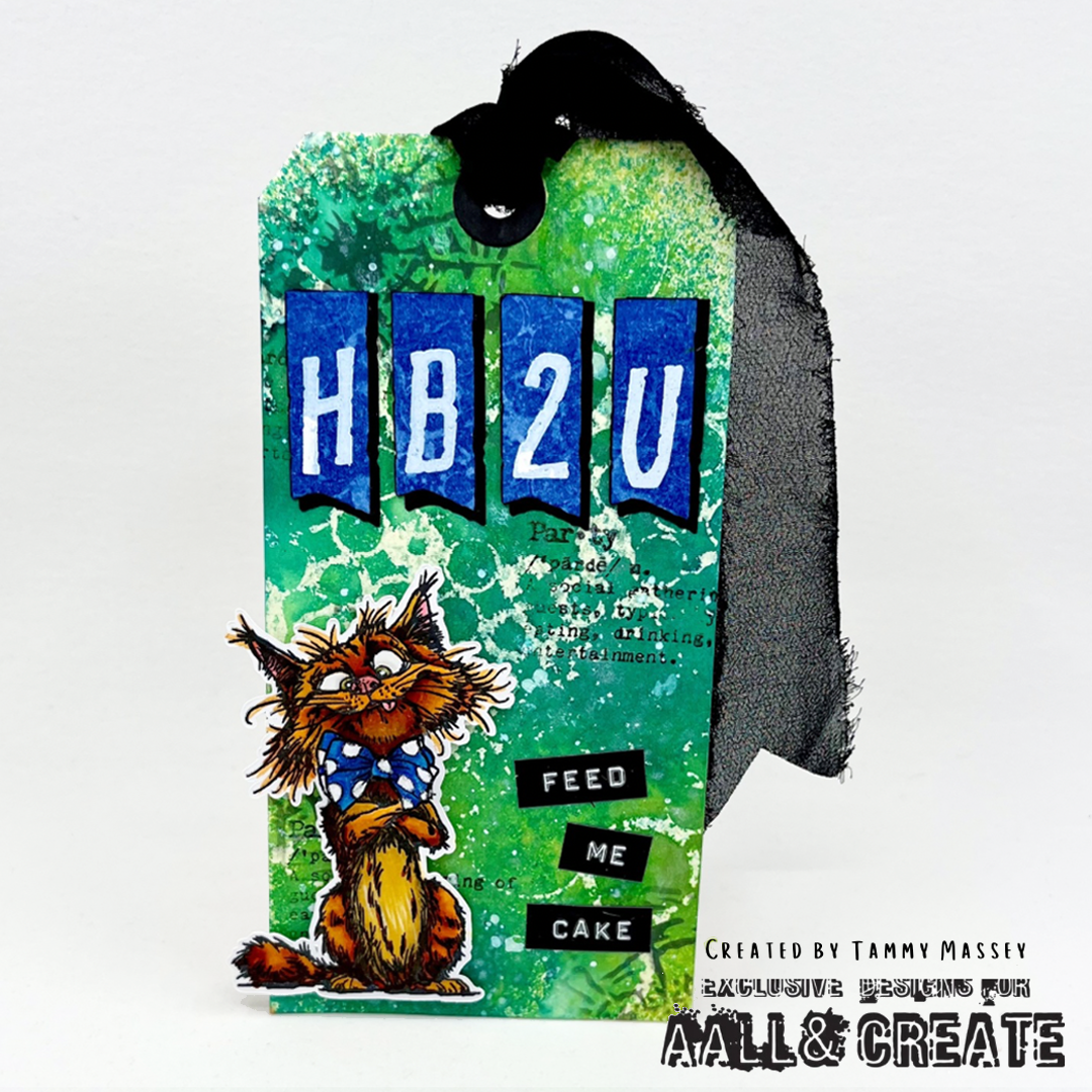 Mixed media gift tag using AALL & Create number and symbol stamps creating 'HB2U' with green textured background, a crazy cat image and 'feed me cake' sentiment. 