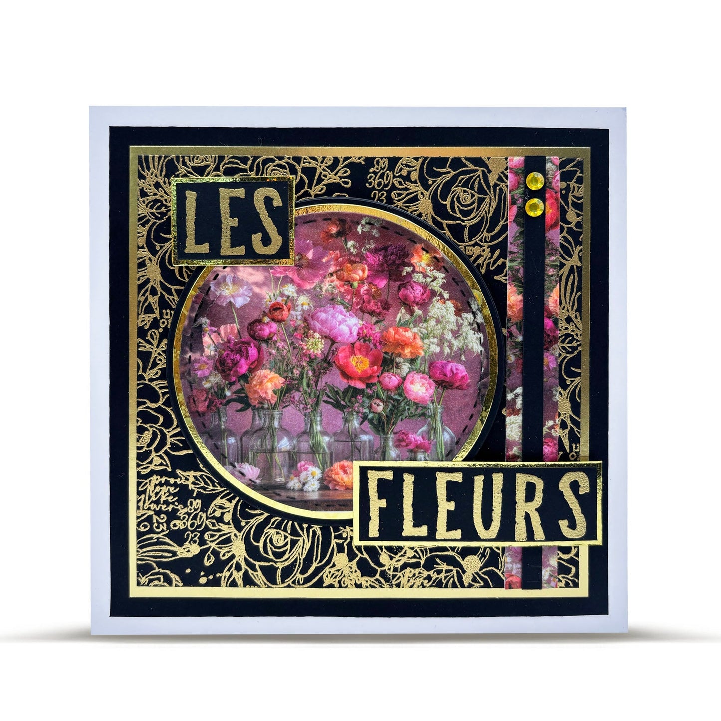 'Les Fleurs' card created with AALL & Create letter stamps, gold embossing on black background with circular floral photograph of pink and purple flowers in vintage French style