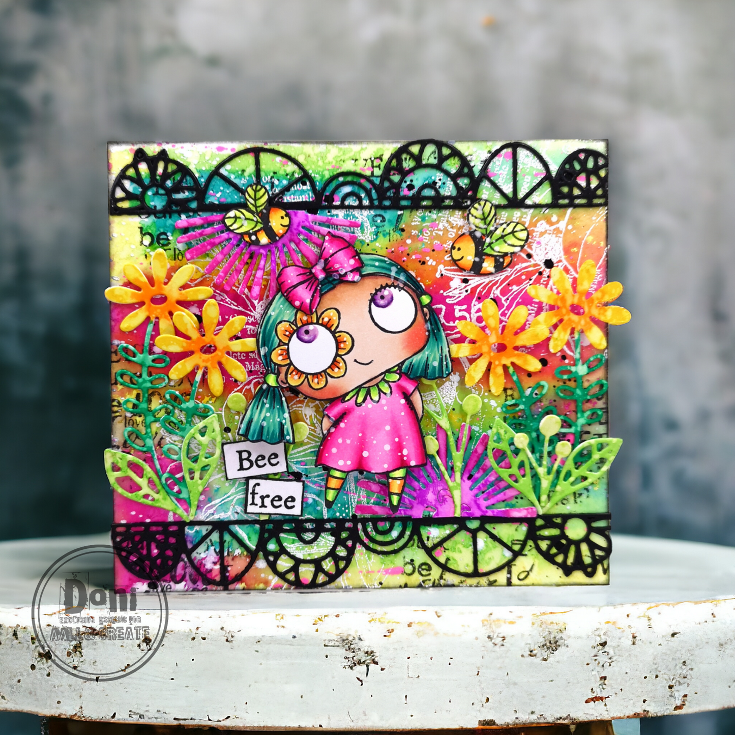 'Bee free' vibrant card made with AALL & Create Floral Fantasy dies in yellow and lime green featuring character with flower accessories, decorative black die-cut borders, and colourful mixed media background