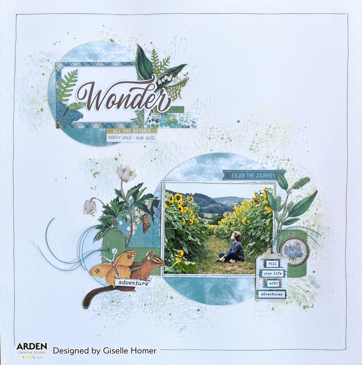 Scrapbook layout sample using Arden Creative Studio Hidden Creek collection, featuring two circular photo mat panels, botanical fern and lily of the valley die-cuts, chipmunk and butterfly die-cuts, teal plaid and botanical patterned papers, ink splatters, and "Wonder / Adventure / Enjoy the Journey / Fill Your Life With Adventures" sentiments.