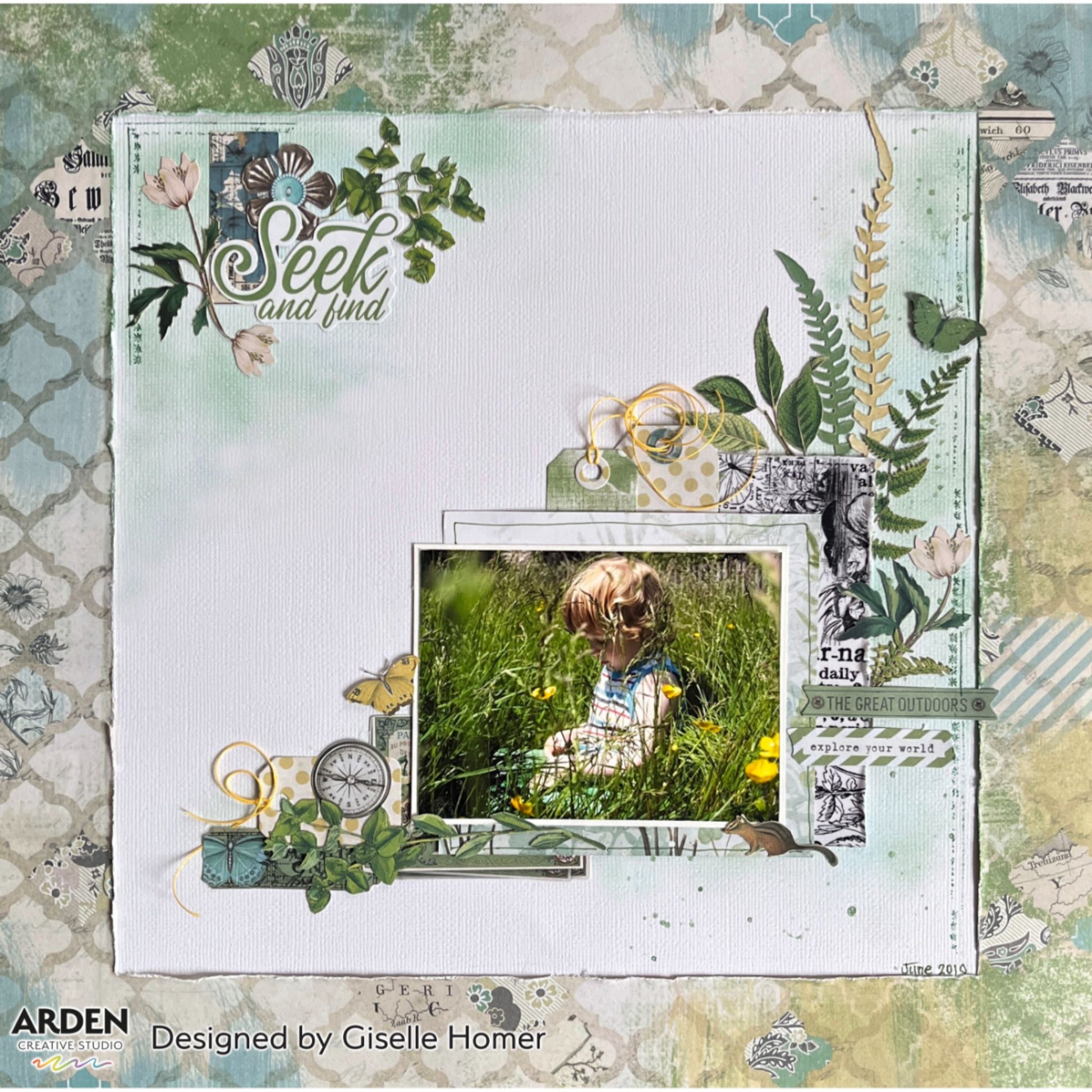 "Seek and Find" scrapbook layout sample using Arden Creative Studio Hidden Creek collection, featuring botanical fern and leaf die-cuts, teal Moroccan lattice patterned paper background, compass embellishment, and vintage newsprint ephemera.
