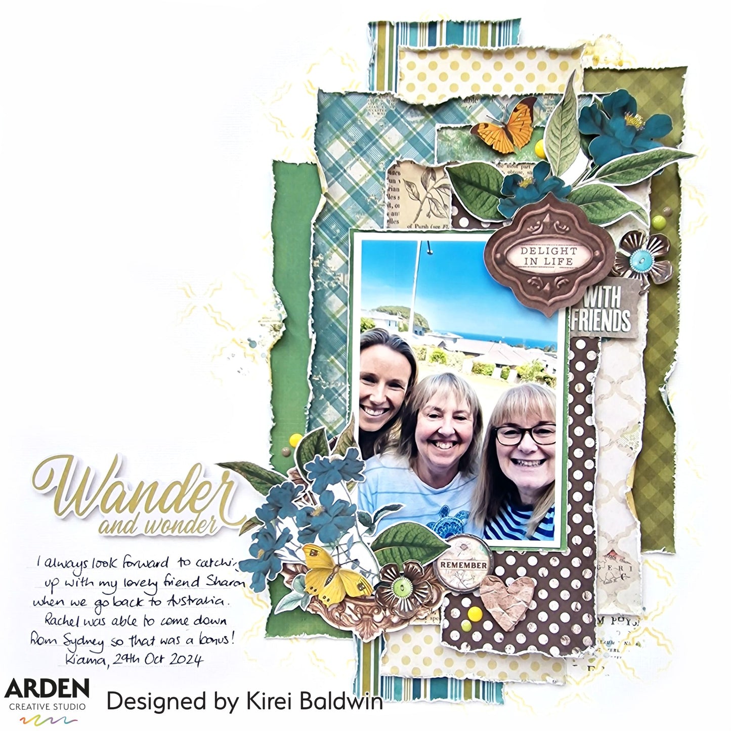 "Wander and Wonder" scrapbook layout sample using Arden Creative Studio Hidden Creek collection, featuring a friends photo, teal plaid and botanical patterned papers, blue paper flower clusters, large leaf die-cuts, and orange butterfly embellishments.
