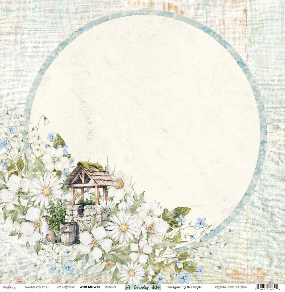 Front of Bee Arty Wish Me Well paper with stone wishing well, floral cluster and large cream circular photo area