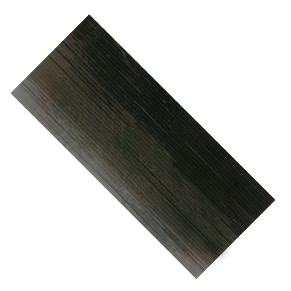 Sheet of black adhesive foam strips on a white background. 