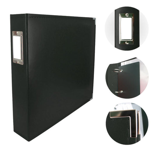 Black binder style scrapbook album with silver corner protector on a white background