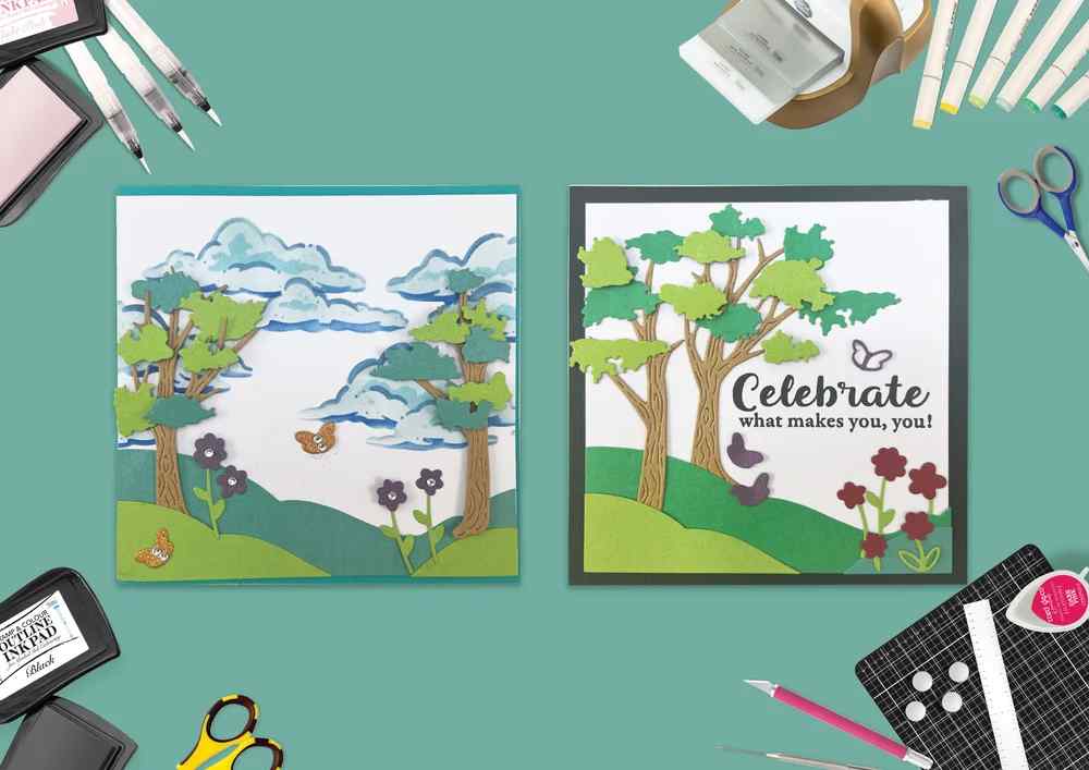 Two handmade spring scene cards made with the Layered Spring Scene die set, featuring trees, rolling hills, flowers, butterflies and a Celebrate what makes you, you! sentiment