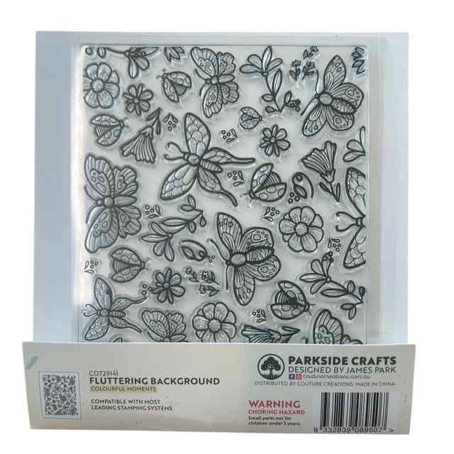 Reverse view of the Fluttering Background photopolymer stamp packaging showing the clear stamp with butterflies, flowers, leaves and garden motifs