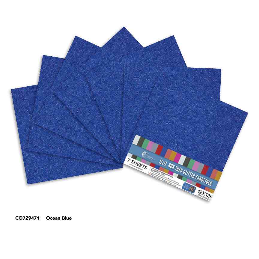 Couture Creations Ocean Blue 12x12 glitter cardstock sheets displayed with product packaging