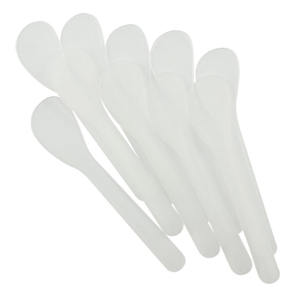 Set of white plastic glue spreaders on a white background